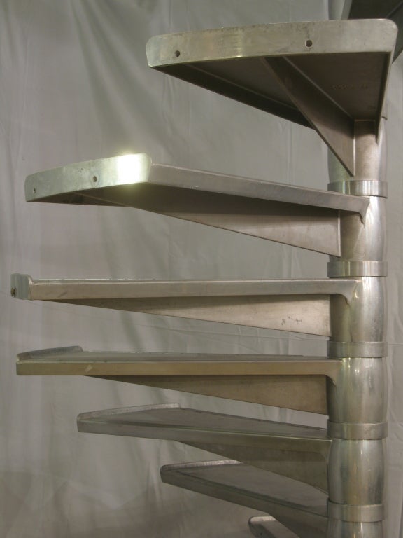 Very rare large staircase made of cast aluminium. Each step is independent and slots onto a central shaft, meaning that the height can be adjusted to suit requirements.

Each step measures (in centimeters):

Length: 73.
Width: 40.
Height: