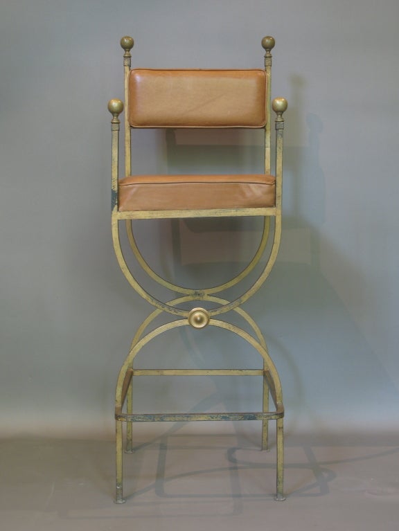 Very decorative, well-made side chair with curule base. Protruding foot rest. Brass details. Newly reupholstered in leather.