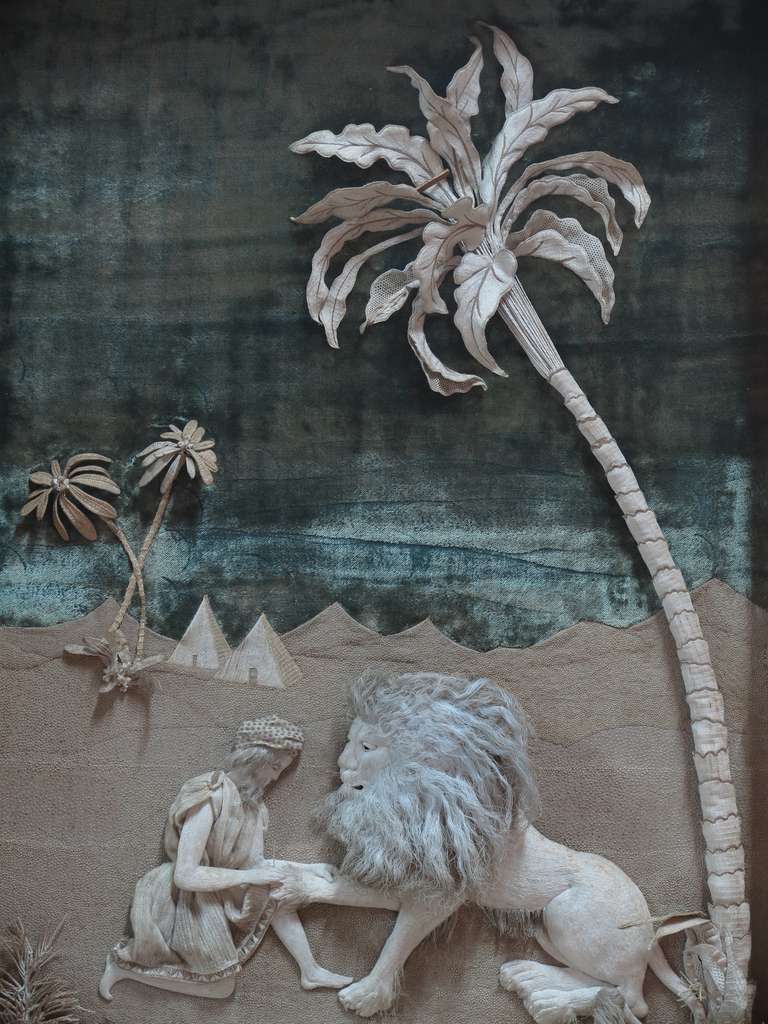 Unique and exquisite picture representing the biblical episode of Saint Jerome removing the thorn from the Lion's paw. The picture is made entirely of fabric, and is in relief.

The scene is set in an oasis in the desert. The sky and water are
