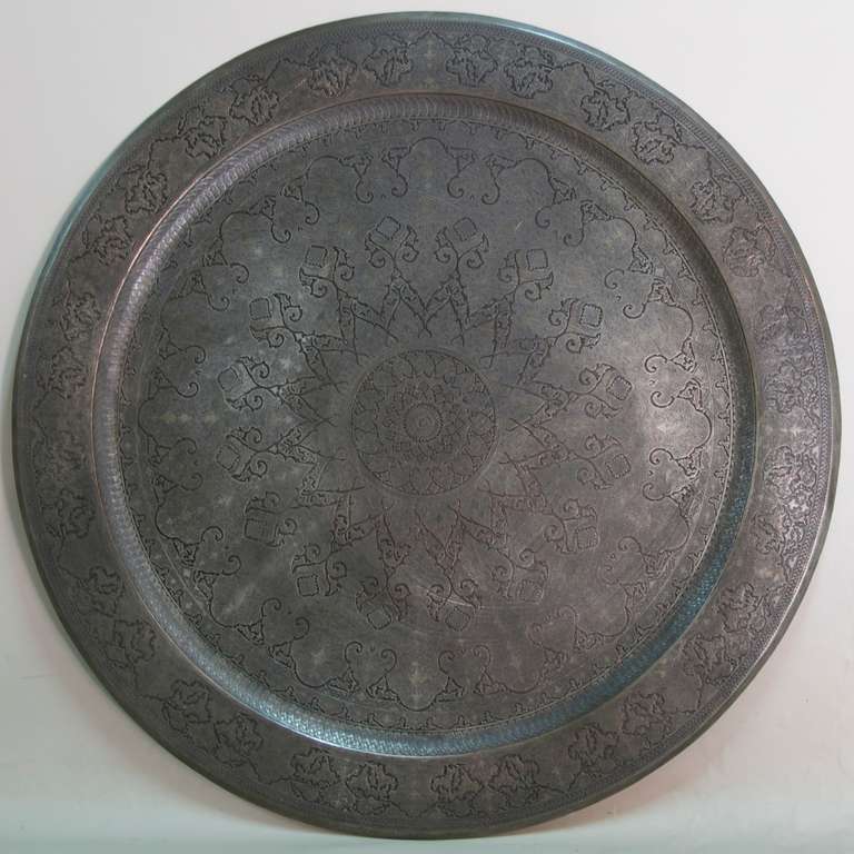 Large and elaborately carved Middle Eastern (Persian?) tinned copper tray. Beautiful craftsmanship. Very heavy.