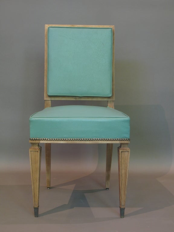 Set of 8 Dining Chairs by Jean Pascaud