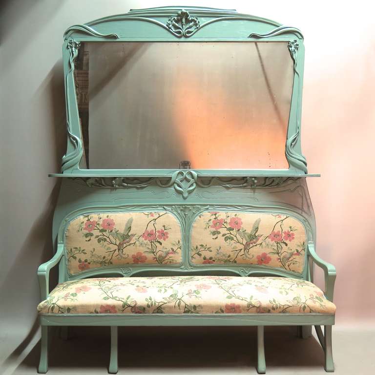 Very lovely and elegant Art Nouveau set comprised of one console and mirror, one settee and mirror, six chairs and two armchairs.

Painted a delicate blue/green color and newly upholstered with a wonderful vintage block-printed toile de jute, with