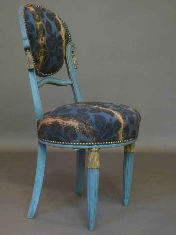 Very charming and well-made petite side chair in the manner of Paul Follot, with rope and tassel detail on the back and legs. Reeded and tapering front legs. 
Original blue color, with details picked out in gold color. 
The chair has been recently