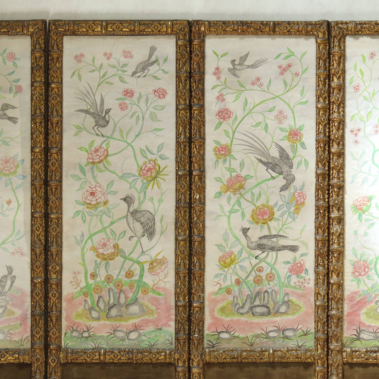 Absolutely charming and unique four-panel double-sided folding screen from the early 1900s.

The top three-quarters of the screen are decorated with hand-painted scenes, in watercolour on paper, representing on one side a bird and flower decor,