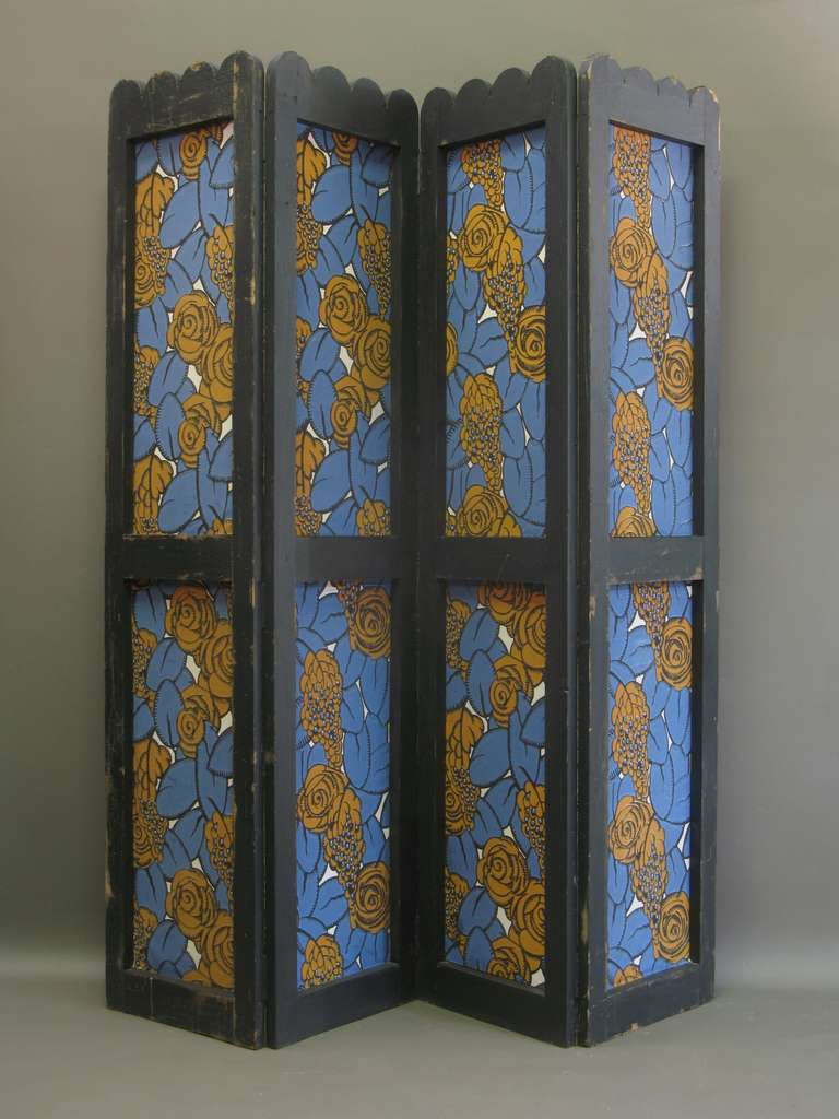 Pair of 4 panel folding screens with a wood surround, painted black, and block-printed paper with an Art Deco floral motif in attractive bold colours. Scallop-edged tops.

Dimensions provided below are per panel. Fully extended, each screen