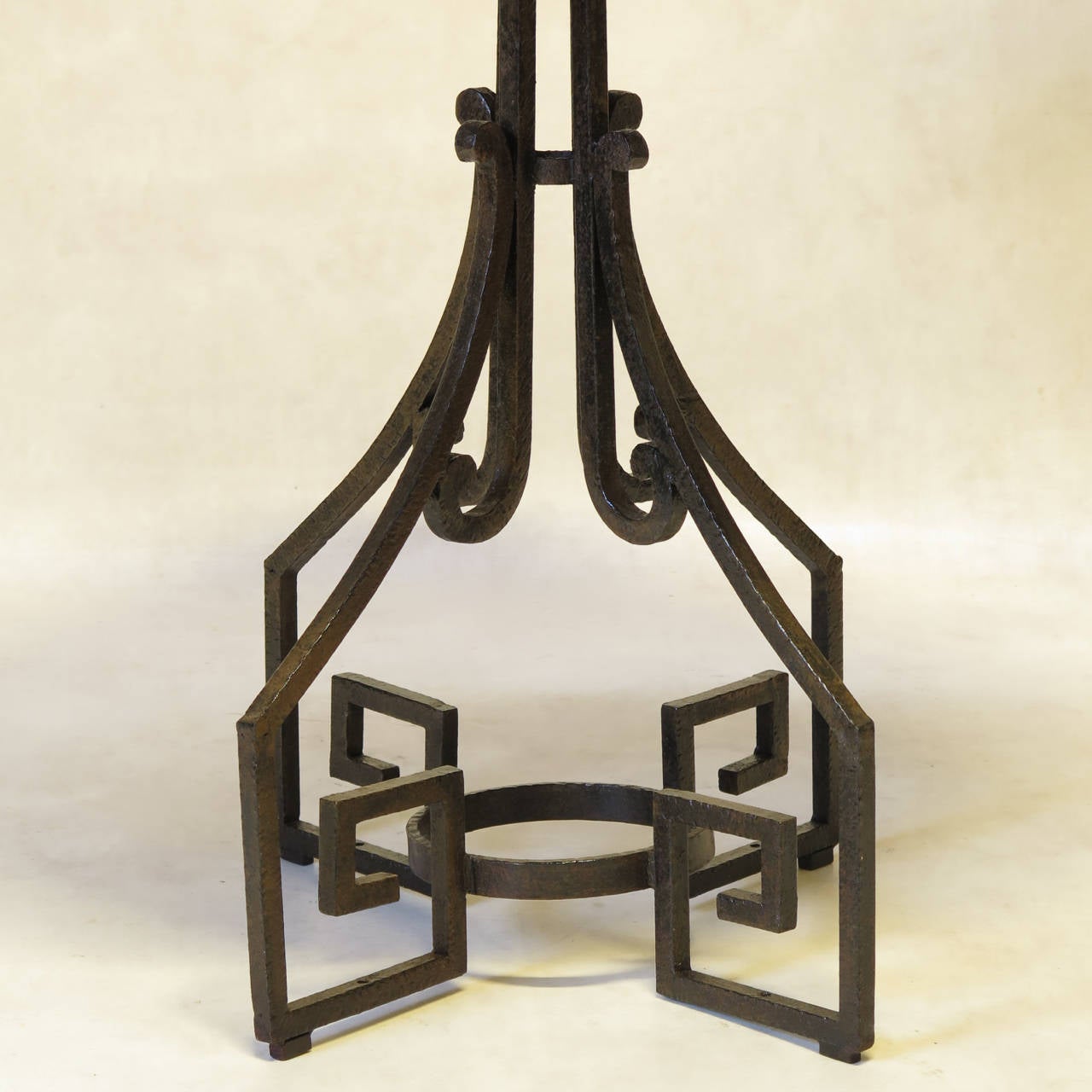 Smart Art Deco wrought iron gueridon with greek key motif and a white marble top.