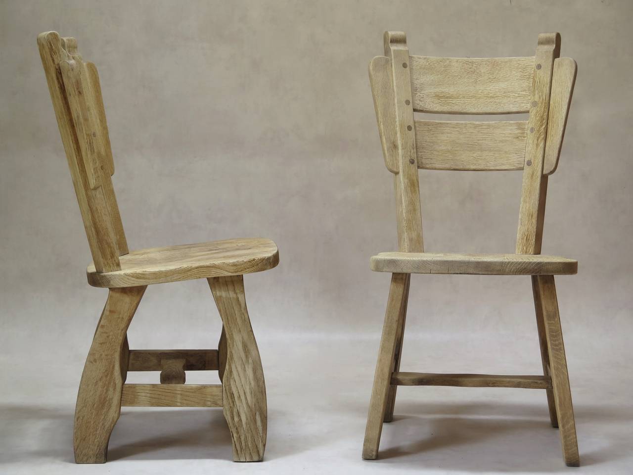 Fun and chunky set of four chalet-style dining chairs of unusual design.