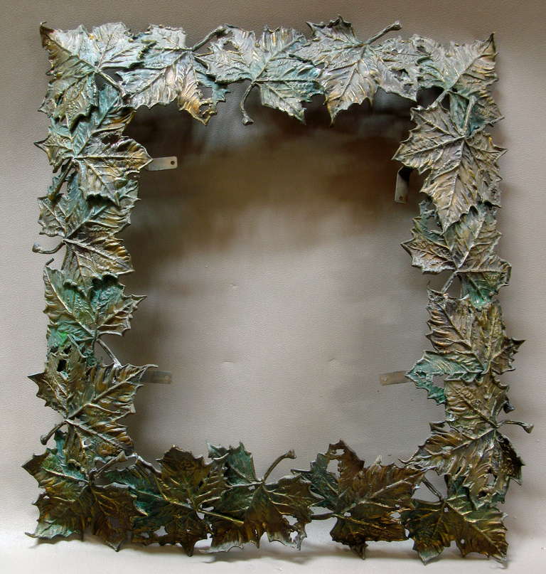 Incredible frame made up of large moulded and assembled bronze leaves with a green and gold patina.