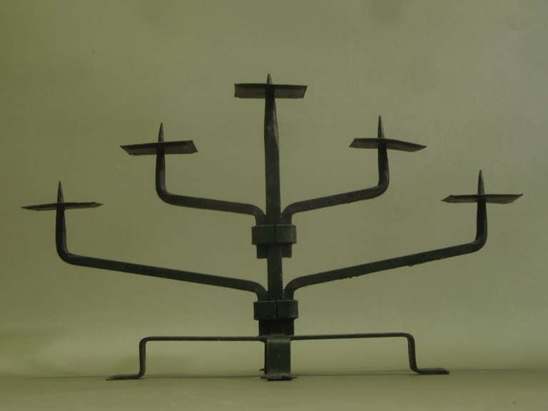 Heavy wrought-iron five-branch candelabras of cubist design, custom-made for a hotel and restaurant in the 60s.