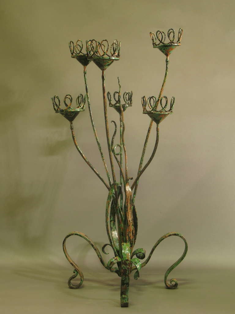 A wonderful and colourful hand-wrought plant stand/ flower pot holder. Very heavy. Lovely patina.