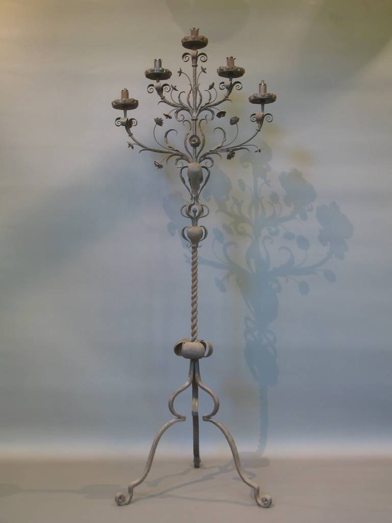 Tall five branch, wrought iron candelabra with tripod base. Floral and foliate motif. Twisted iron centre rod. Beautifully made. Very elegant.