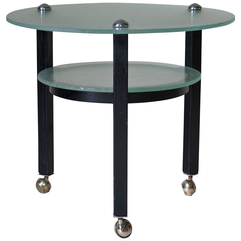 Two-Tiered Glass and Iron Side Table on Casters For Sale