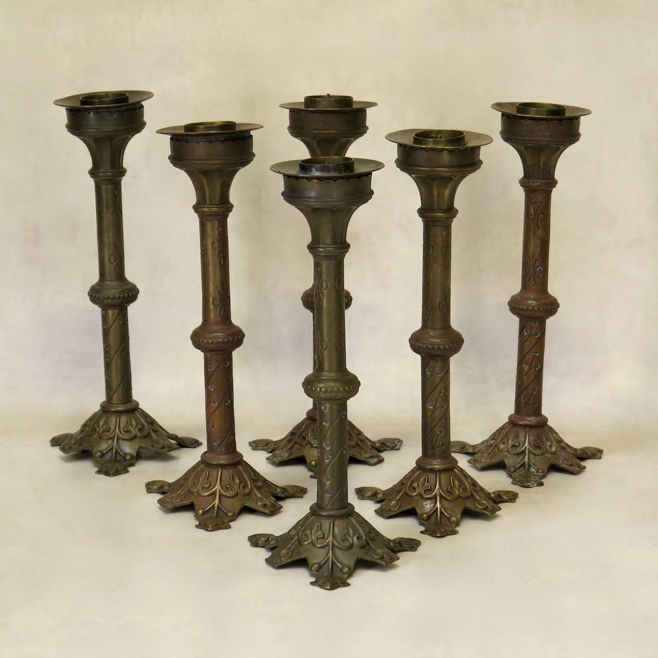 Handsome set of six large brass candle holders of Medieval style.