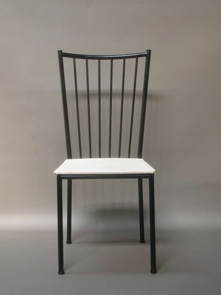 Great set of 6 dining chairs by French designer Colette Gueden. Wonderful tubular iron structure, painted black. Nice clean lines, wide curved backs. Original upholstery.
If necessary, two very similar chairs are also available. The only difference