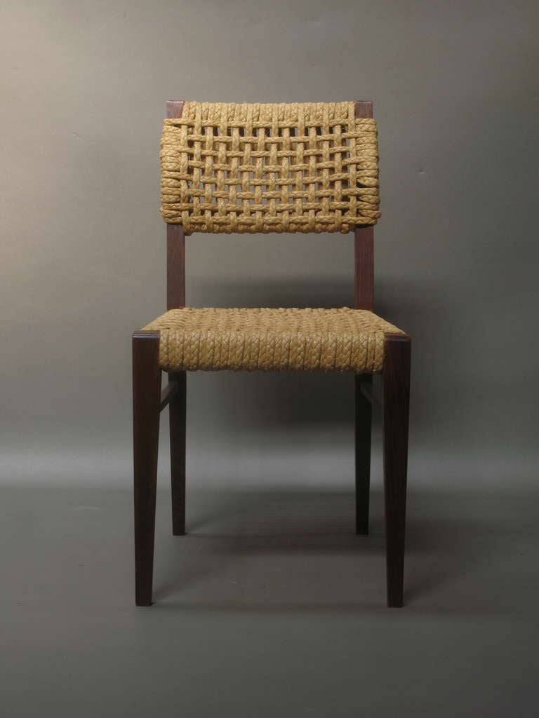 Set of six dining chairs by Audoux-Minet for Vibo, with a stained wood structure and braided rope seats and backs. Lovely design. Very comfortable.