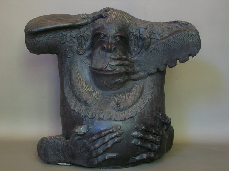 Large gorilla fashioned out of clay and painted black.

He has a wonderful expression.