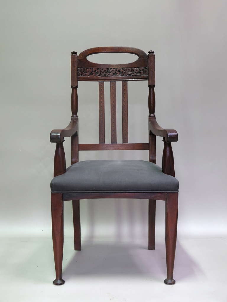 Pair of mahogany Arts & Crafts armchairs with wide seats and elegant proportions. Ivorine labels attached beneath: 'S.J.WARING & SONS, By appointment to the Queen, 175-181 Oxford Street W. LONDON : LIVERPOOL : MANCHESTER : PARIS'