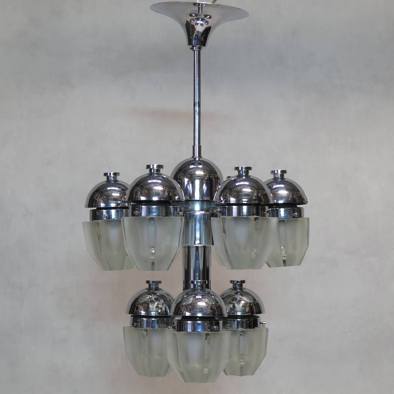 Nine-light chandelier with a chromed structure and very thick cut-glass shades.