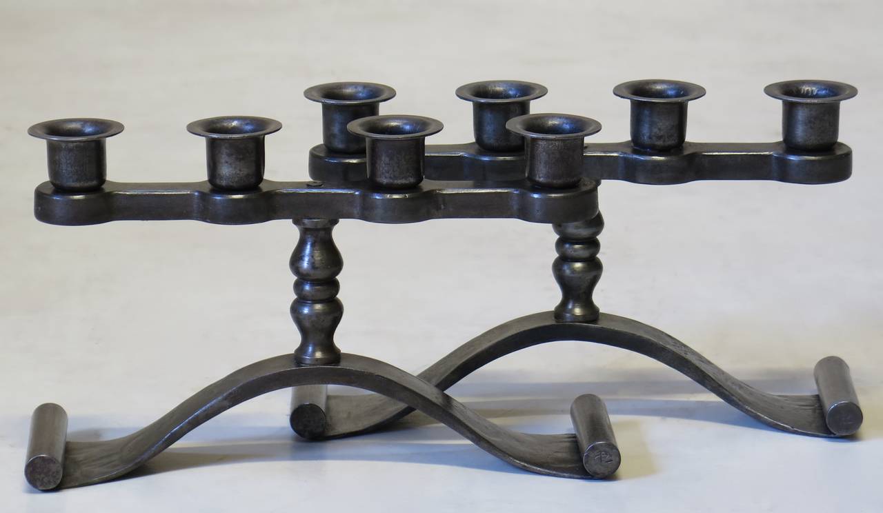 Elegant pair of Art Deco iron candleholders by Charles Piguet. Signed on the base.