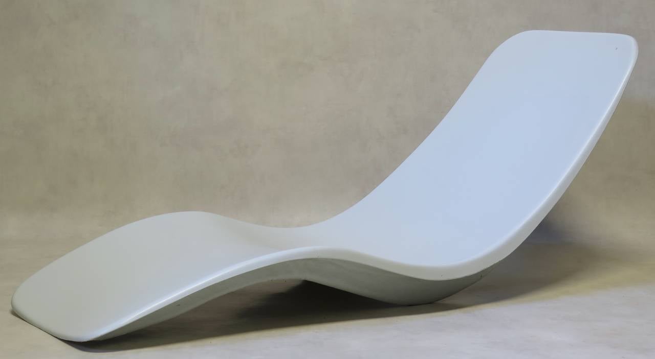 Iconic white lacquered fiberglass sun loungers by Charles Zublena.