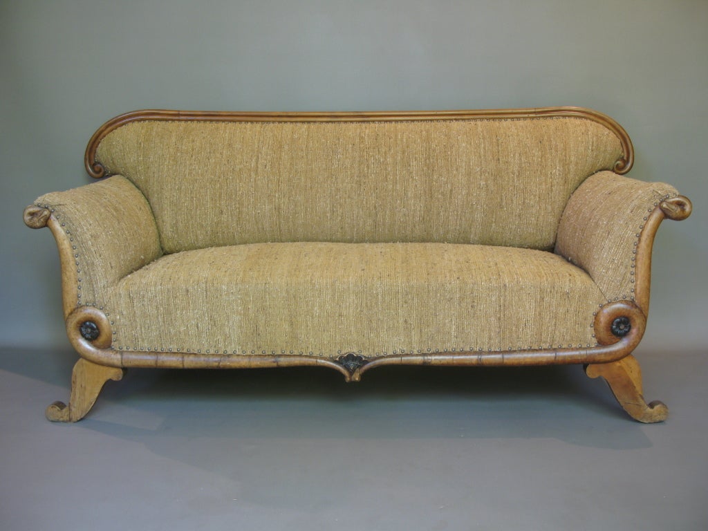 Lovely and original settee. The structure skirting the seat and armrests represents two serpents.
Scrolled armrests. Rosette detailing.
Nexly reupholstered in vintage wool fabric.
Wood may be burl walnut.