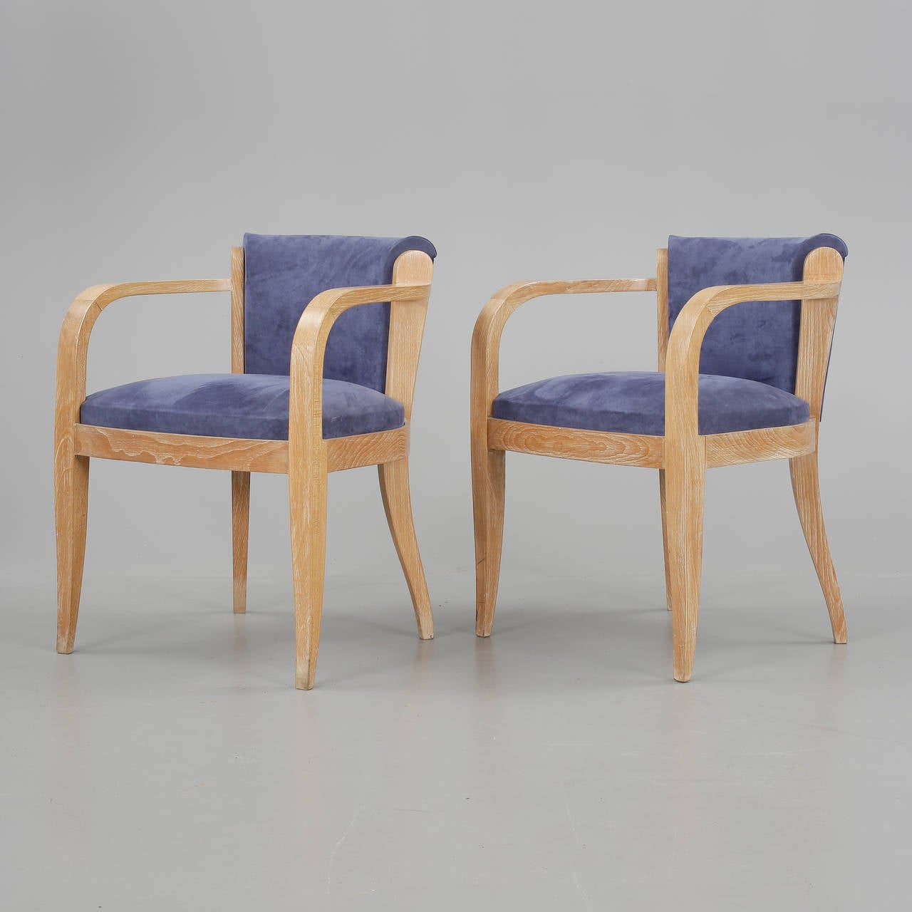 A pair of French armchairs, circa 1940s.
Faux Cerused Oak finish and suede upholstery.