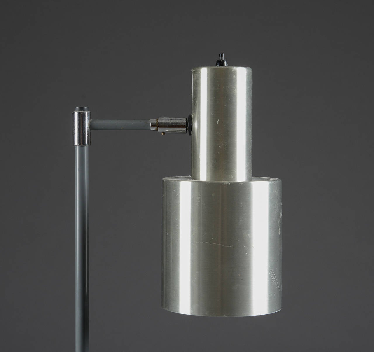 A floor lamp by Jo Hammerborg for Fog and Morup, Denmark, circa 1960s. Made of aluminum and brown grey lacquered metal, adjustable shade. Height 57
