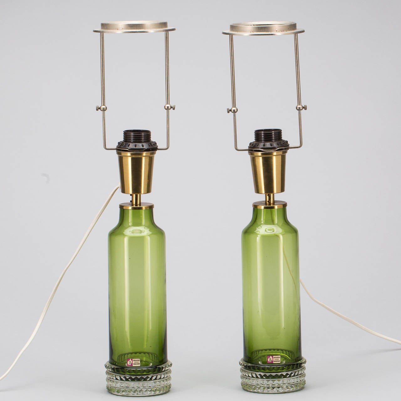 A pair of table lamp designed by Gunnar Anderson for Lindshammar, Sweden, circa 1960.
Green glass. Base height 15