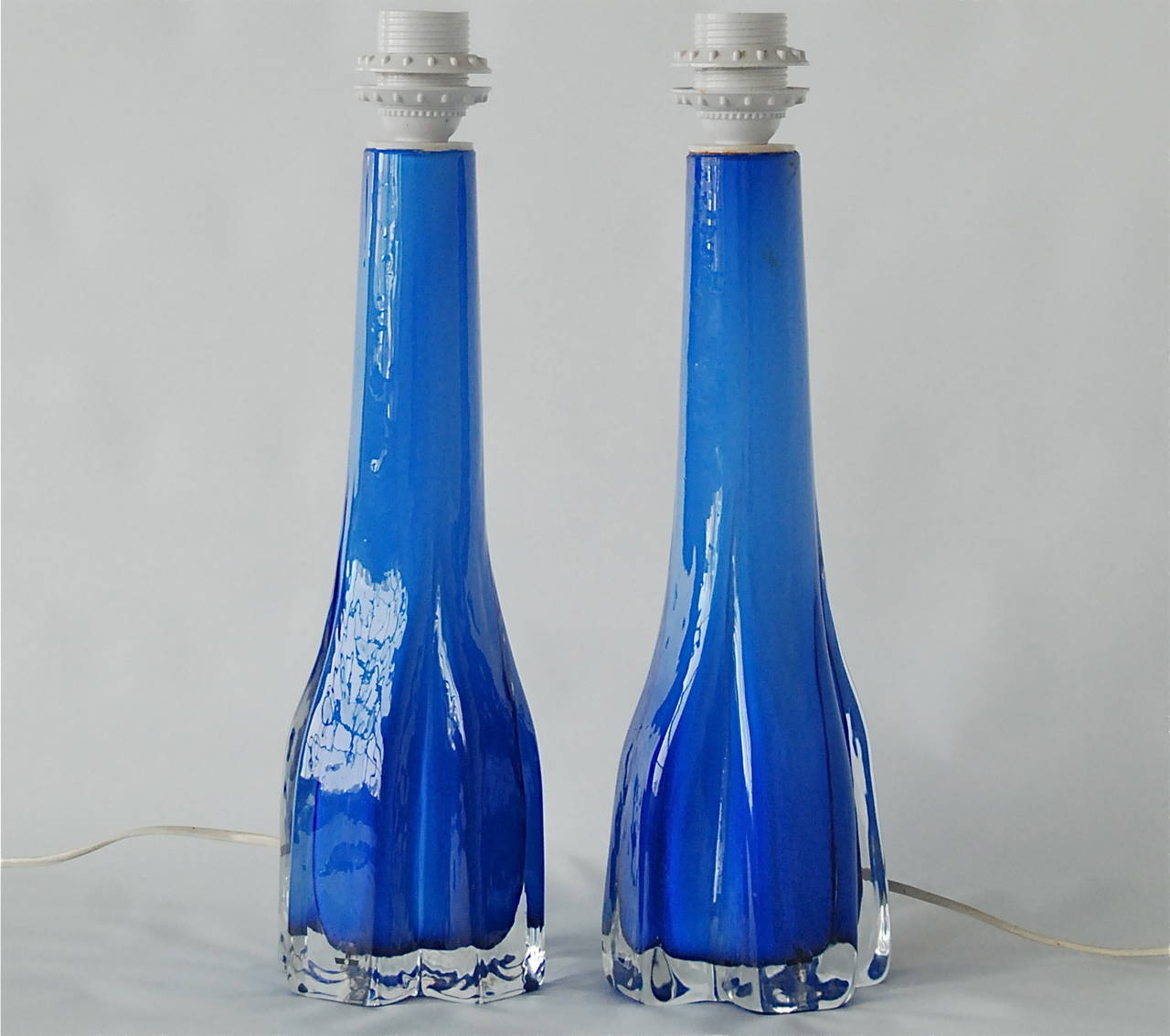 A pair of table lamps by Flygsfors, Sweden, circa 1970.
Tinted glass. Base height 14