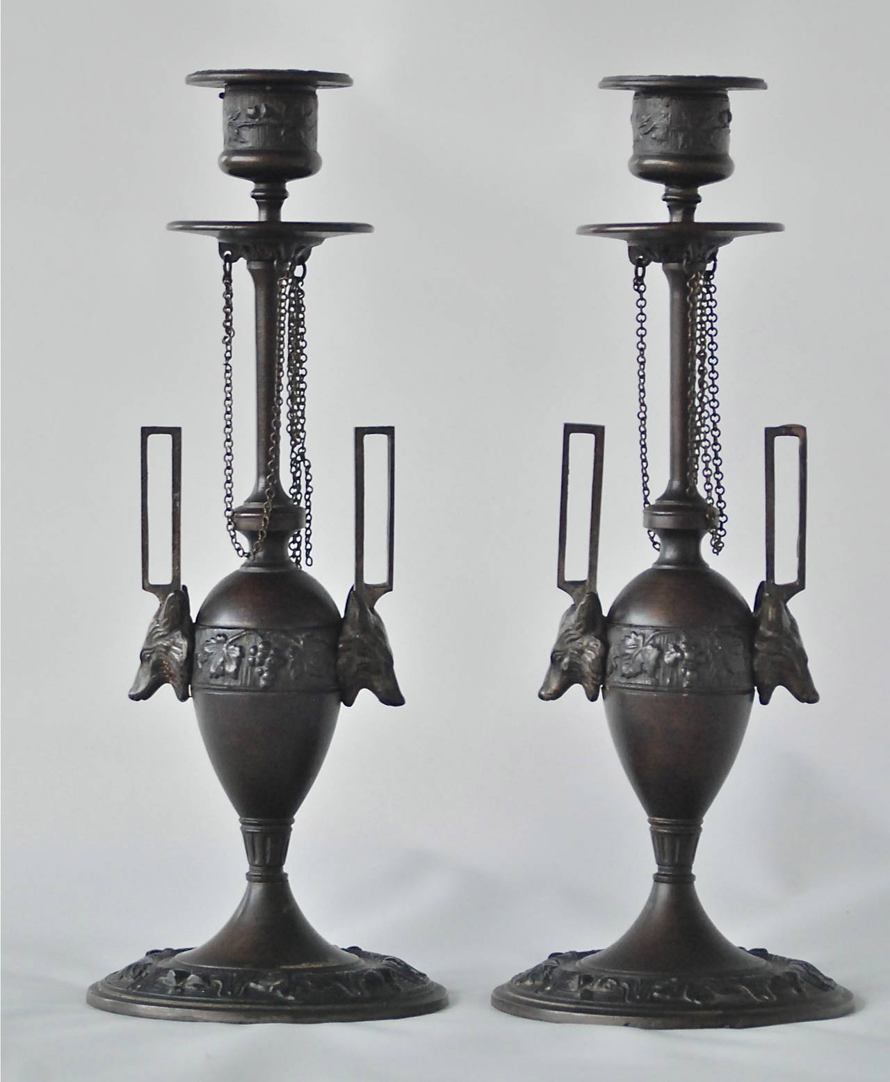 A pair of candleholders by F.L. Vombach, Germany, circa late 19th century.
Patinated metal.
Marked: F. L. Vombach Offenbach A/M.
Measures: H 10.5