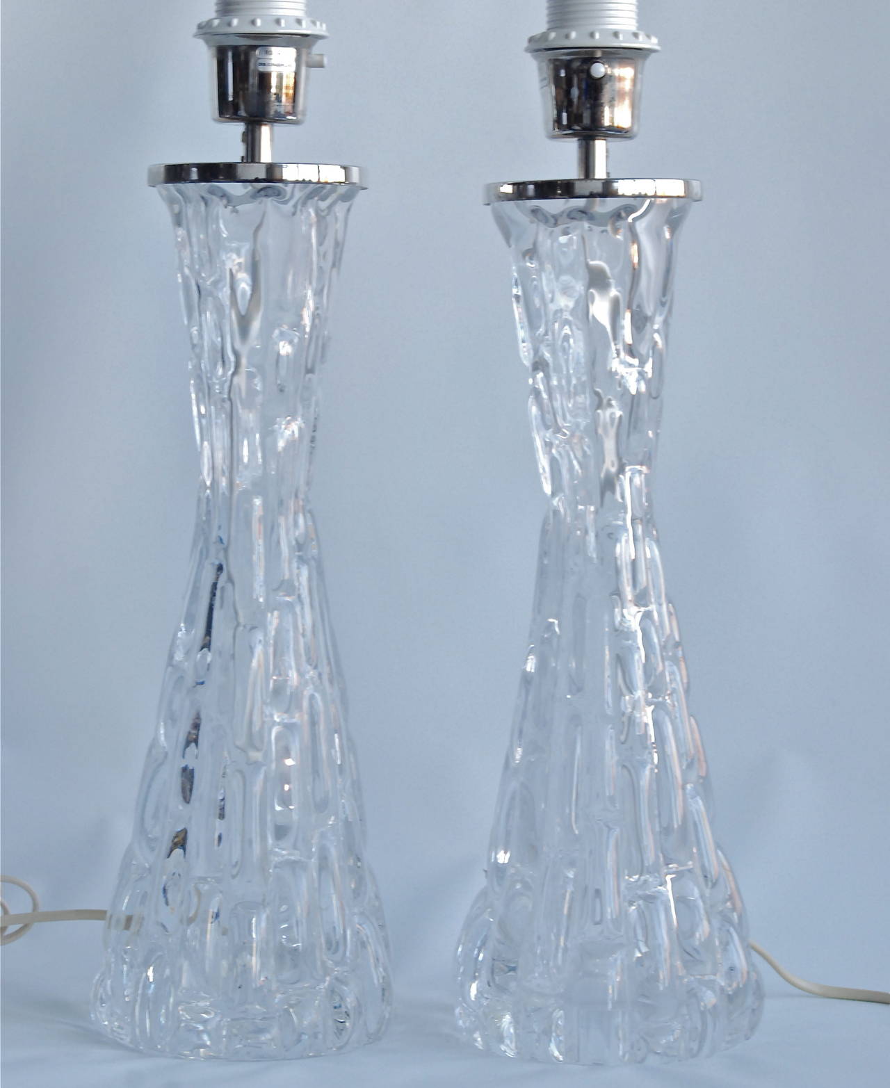 A pair of large table lamps designed by Carl Fagerlund for Orrefors, Sweden, circa 1960.
Model RD 1477, marked by manufacturer.
Glass base height 15