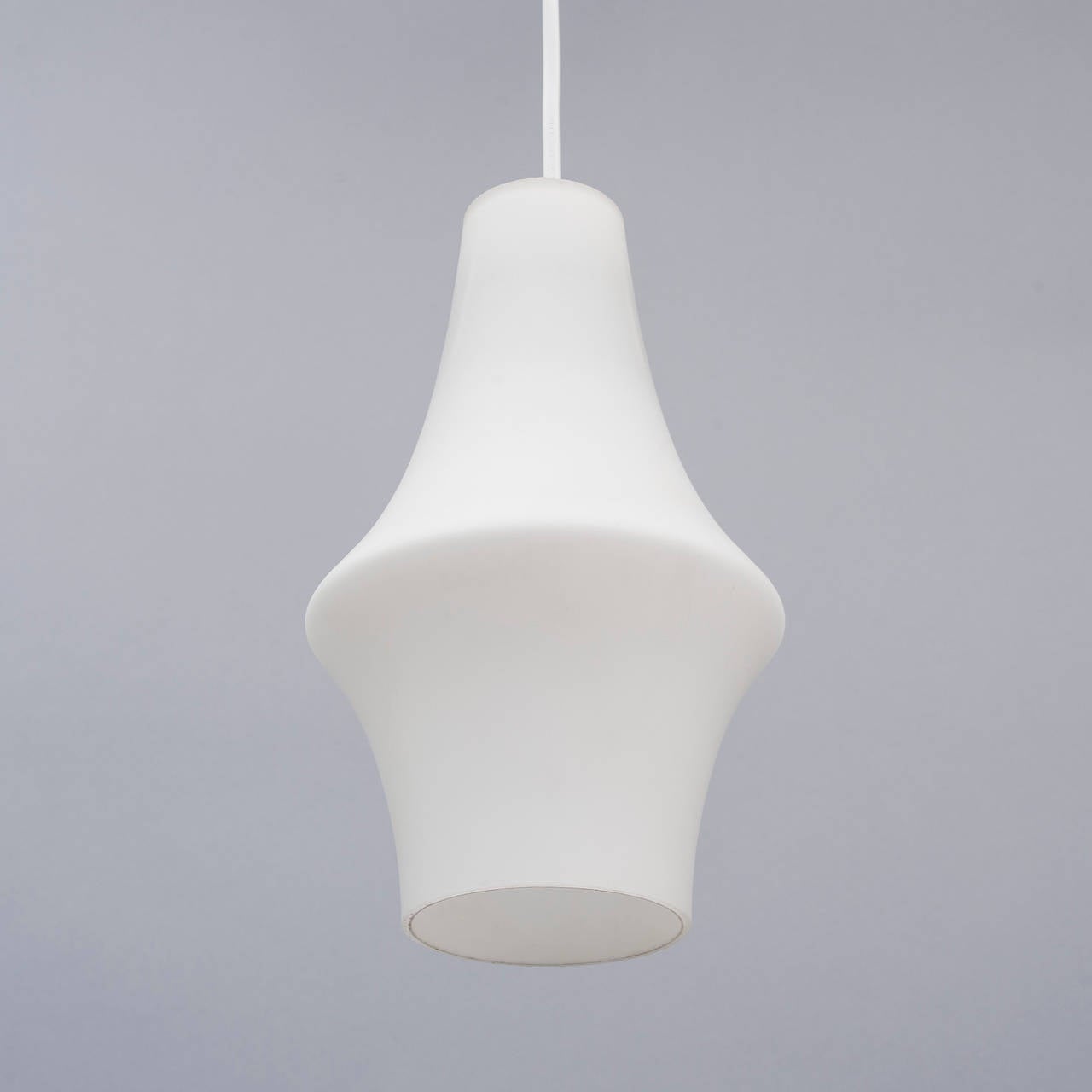 A pendant designed by Lisa Johansson-Pape for Orno. Finland. Model 66-077, circa 1960s.
Frosted glass pendant height is 10