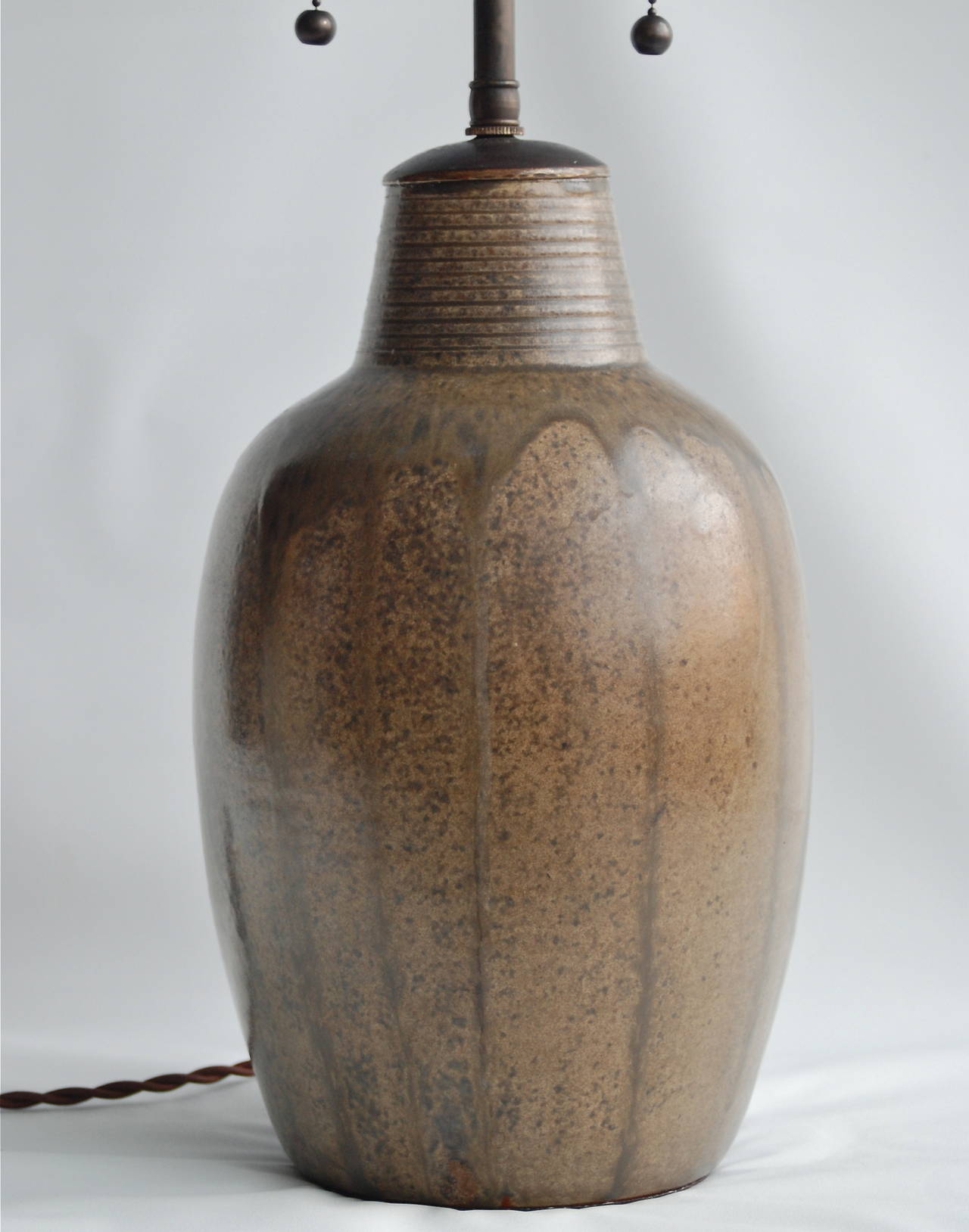 Patrick Nordström, table lamp, ceramic.
A table lamp by Patrick Nordstrom (1870-1929), Sweden. Ceramics with brown glaze. Marked: 'NP ISLE 1924.' Made in his own workshop in Islev.
Dimension: H 23