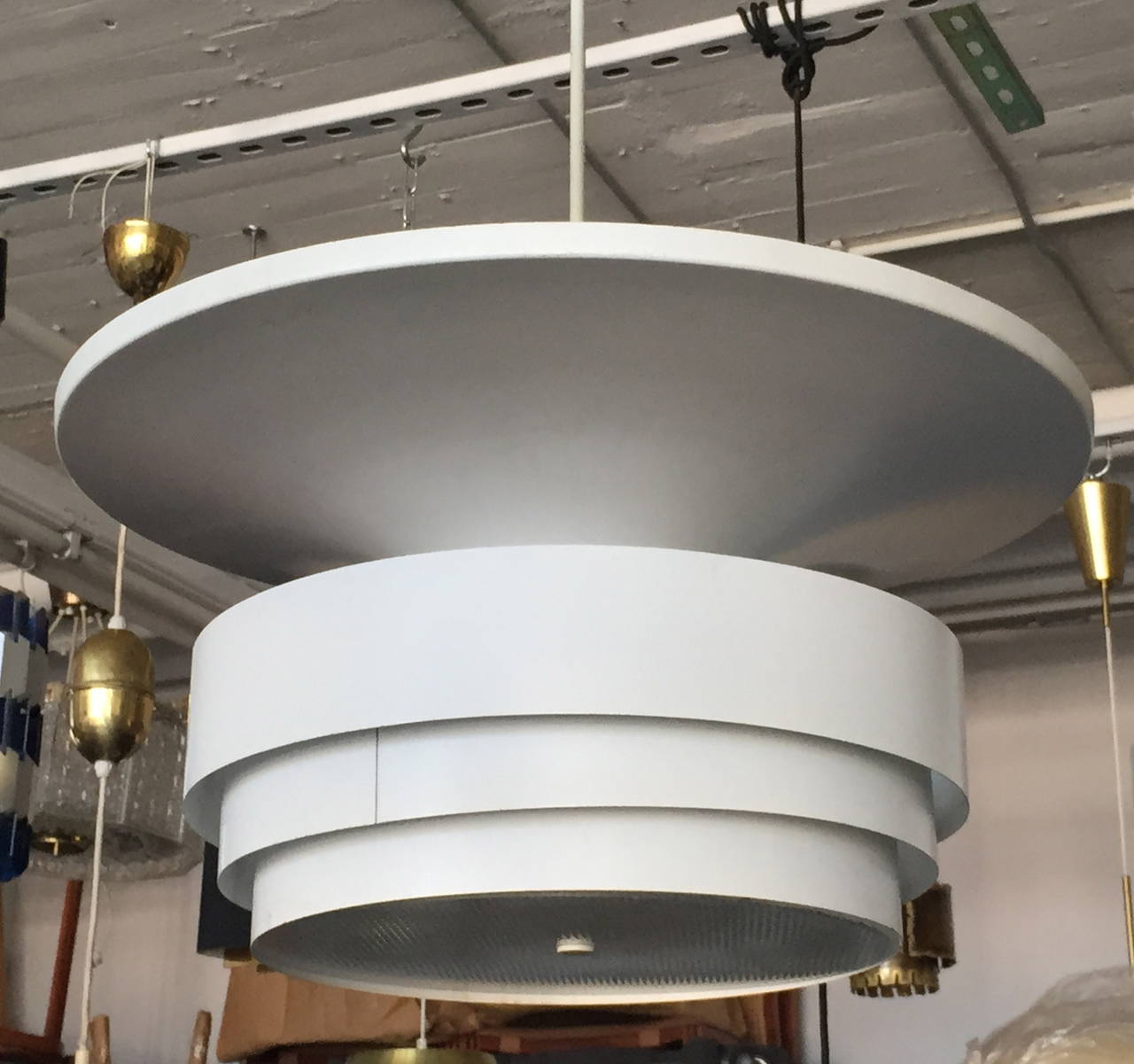 A pendant designed by Hans-Agne Jakobsson for Markaryd, Sweden.
White painted metal and plastic diffuser. Measure: Diameter 24