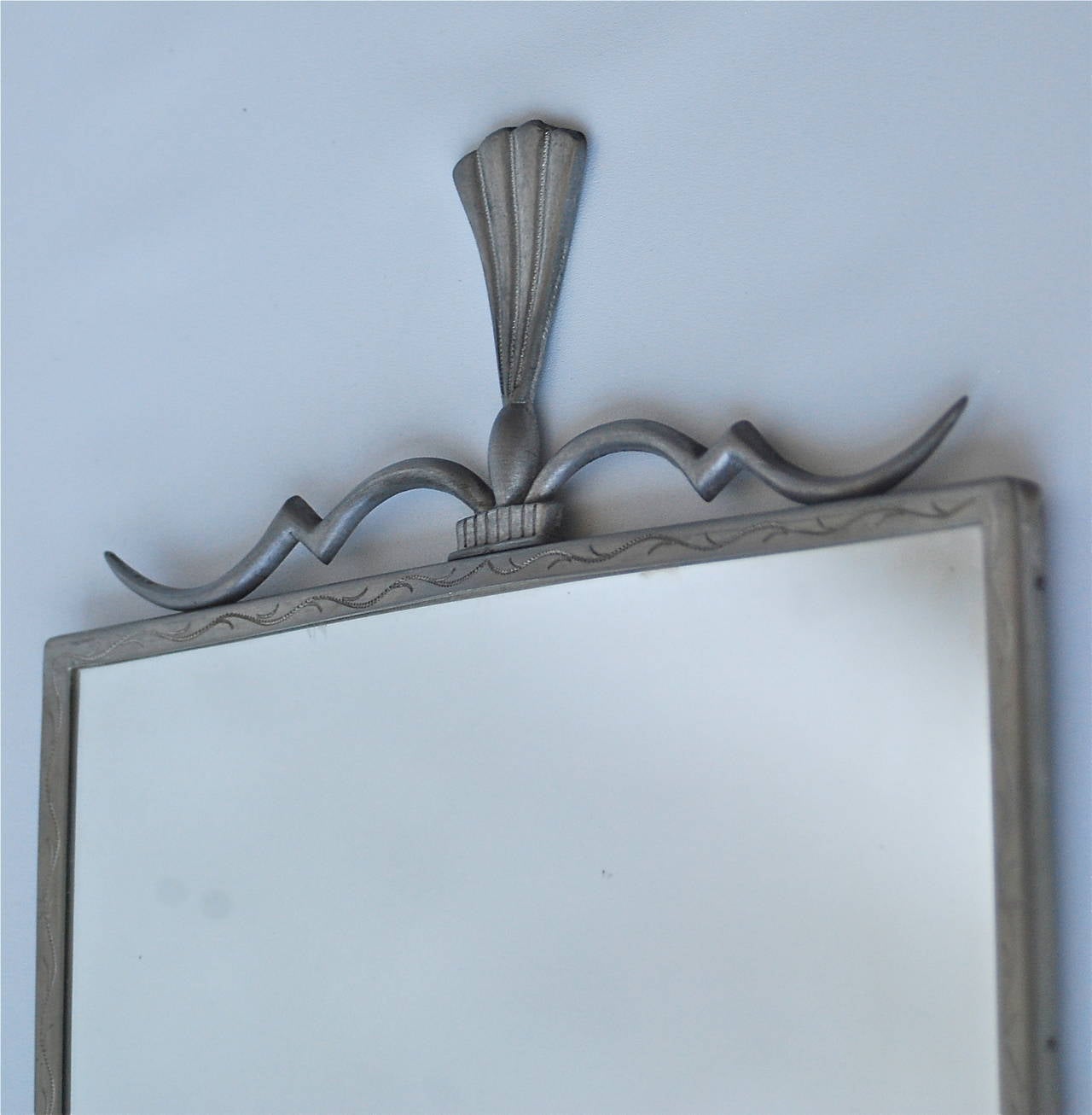 A mirror, pewter, signed N. Nordstrom, circa 1930s.
Dimensions: 22