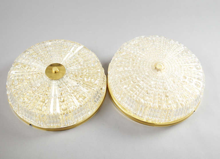 A ceiling light by Carl Fagerlund for Orrefors, Sweden, circa 1960.
Measures: Glass and brass, diameter 38 cm (15")
Existing European wiring, re-wiring available upon request.
(Three) fixtures available. Price is for each.