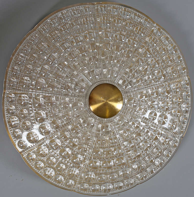 A Ceiling light by Carl Fagerlund for Orrefors, Sweden. Circa 1960th
Textured glass with brass hardware. 6 Candelabra style sockets. Diam. 15.75