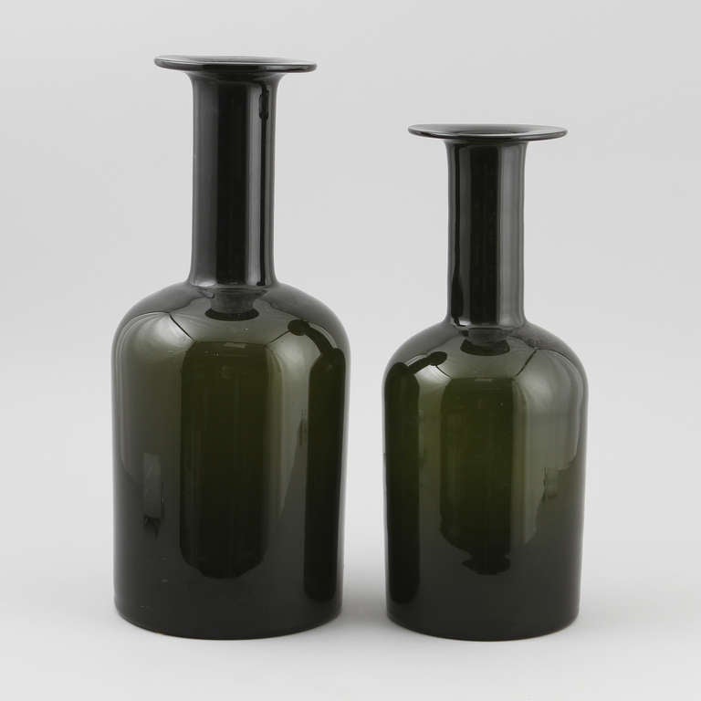 A pair of oversized bottles or vases designed by Otto Brauer for Holmegaard. Denmark, circa 1960.
Tinted glass. Measures: H- 19.5