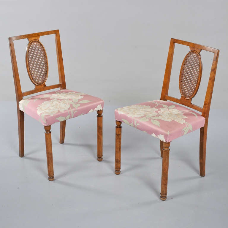 A pair of "Coolidge" chairs by Axel Einar Hjorth for Nordiska Kompaniet.
Swedish, circa 1928. NK tug with numbers attached on both chairs.
Original wood finish and cane. Later reupholstery. Minor scratches.
