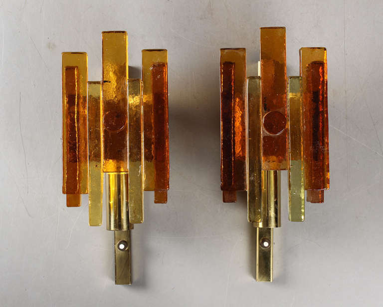 A Pair of Danish wall lights, Denmark, circa 1960th.
Design attributed to Svend Aage Holm Sorensen.
Tinted glass and brass. Height 12.5