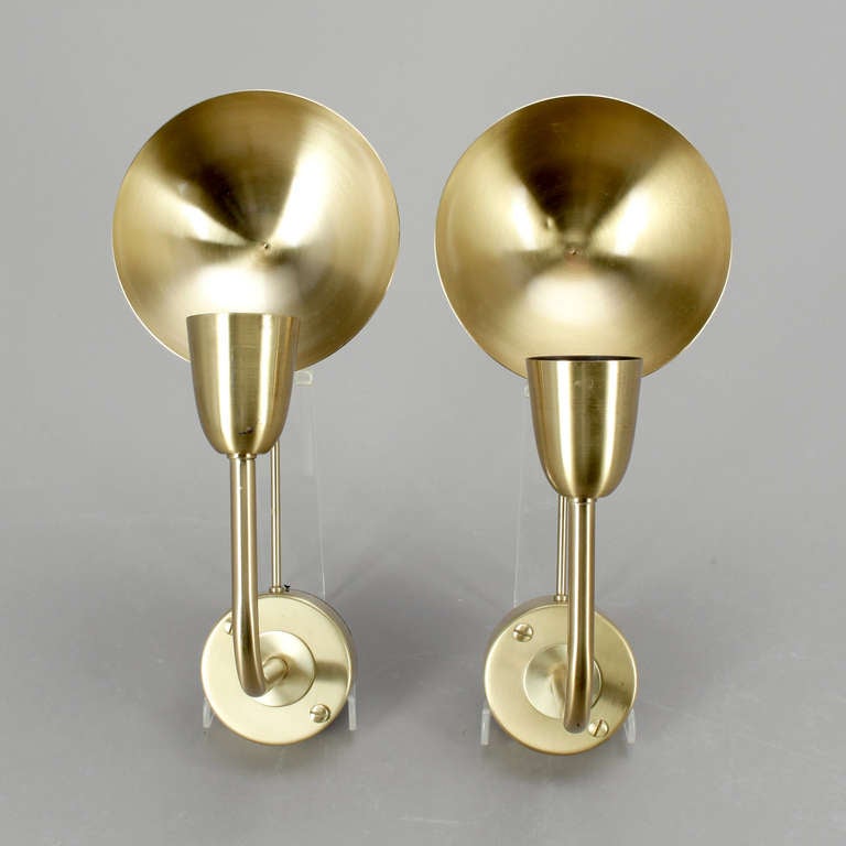 A pair of wall lights by Hans-Agne Jakobsson, Sweden, circa 1960.
Polished brass. Marked by manufacturer. H-13