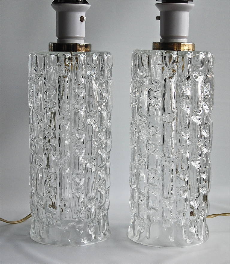 A pair of Swedish mid-20th century glass table lamps, textured clear glass. Existing European wiring. Rewiring available upon request.
Glass base H- 12