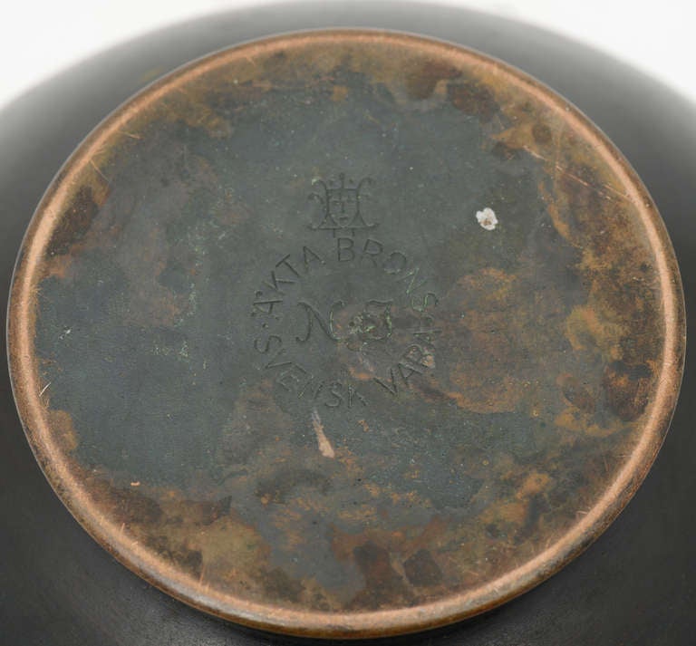 Patinated bronze urn by Akta Brons Svensk Vara NJ,
Sweden. 
Marked by manufacturer.
Light engraving with text on one side, not visible from the distance.
Diameter: 8