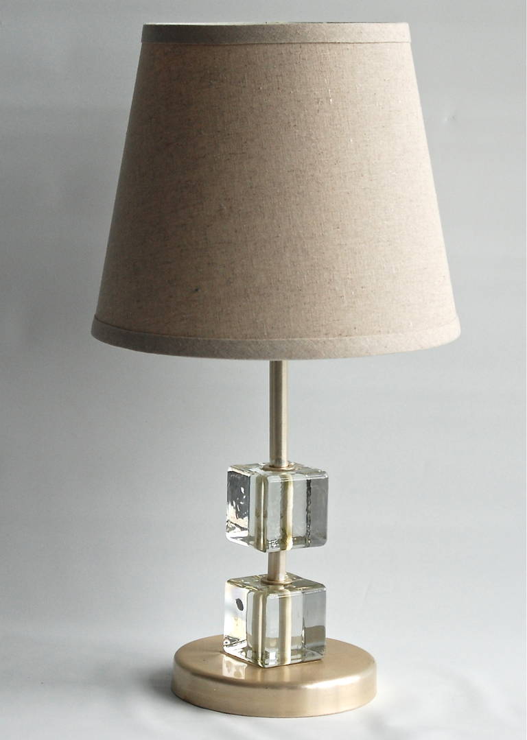 A table lamp, probably, Sweden, circa 1960s.
Clear glass cubes and brass.
Existing European wiring, rewiring available upon request. Shade not included.