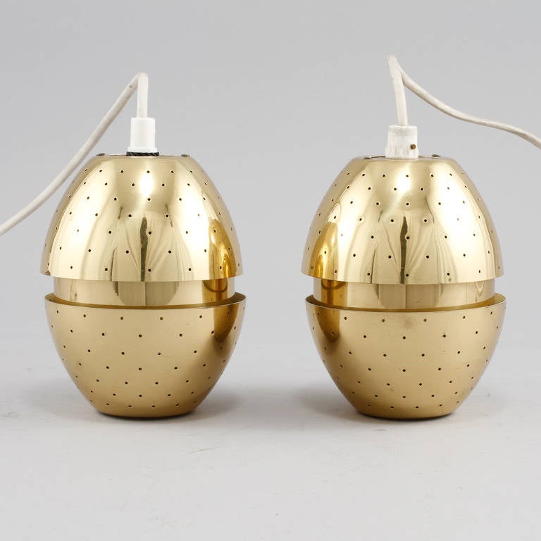 A pair of pendants designed by Hans Agne Jakobsson, Sweden, circa 1960s.
Perforated polished brass.
New wiring required.