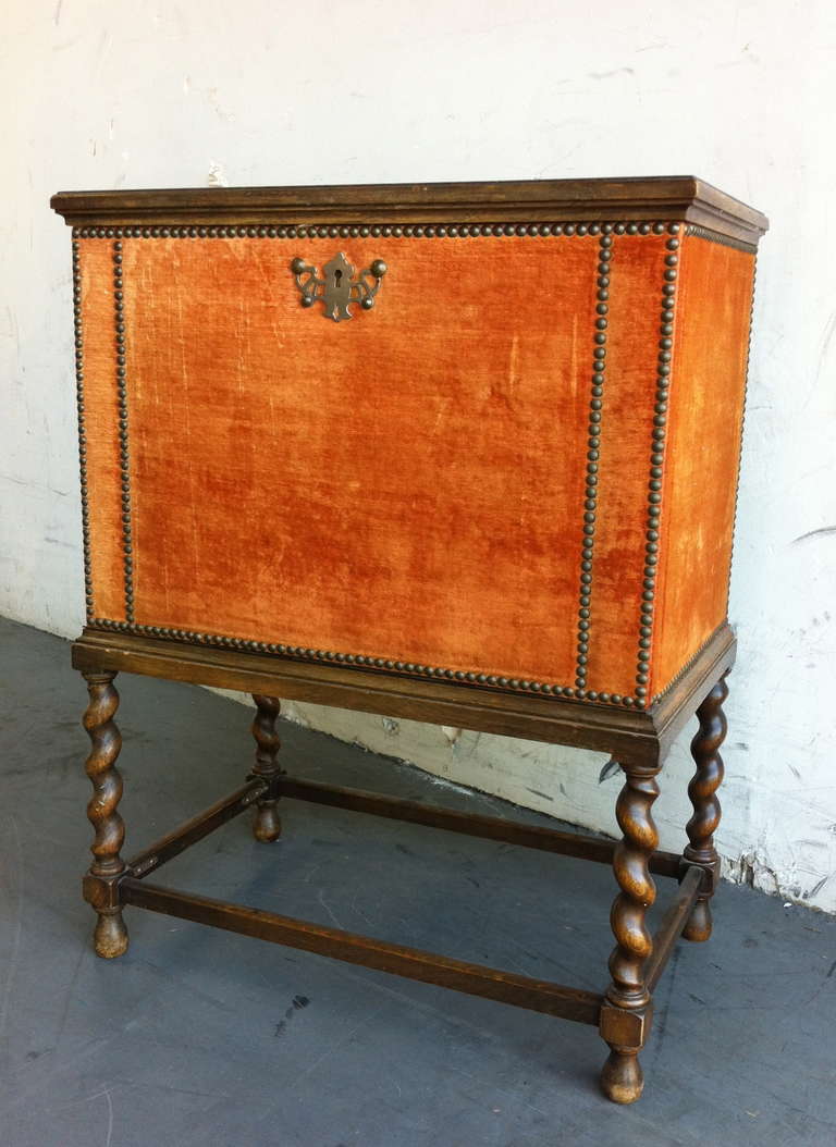 A small cabinet or nightstand, design attributed to Otto Schulz. Sweden. Stained wood with velvet upholstery decorated with nailheads. Clear maple interior with adjustable shelf. Key included. Label on the back: 