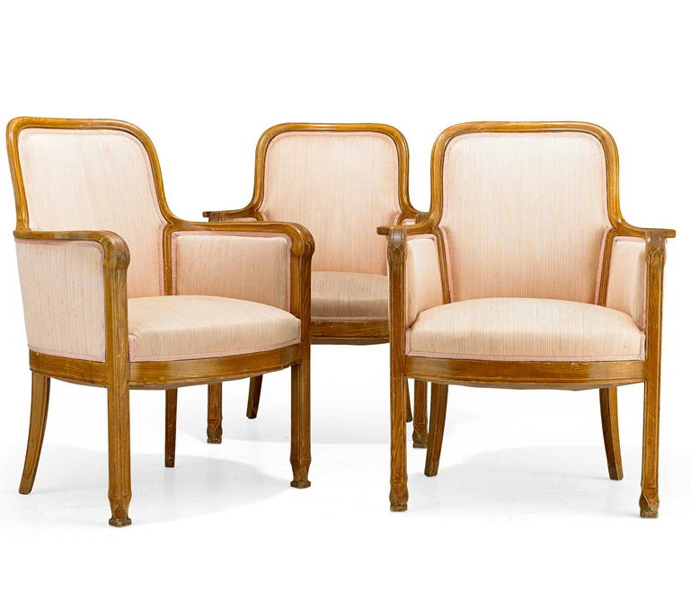 The armchairs, design attributed to David Blomberg for Nordiska Kompaniet, Sweden, circa 1909.
Stained elmwood with carved decoration. H-36