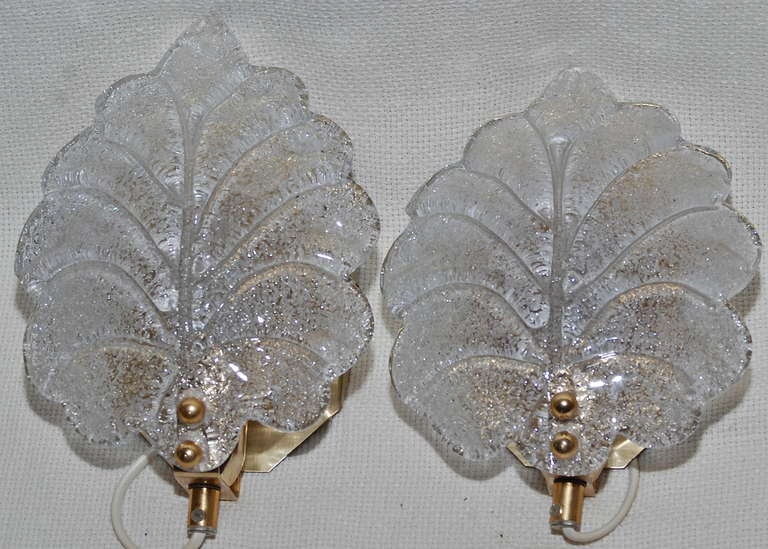 A pair of sconces, glass probably by Orrefors, circa 1960.
Brass and handblown frosted glass.
Designed for one candelabra style, 40w bulb.
Dimensions: 9