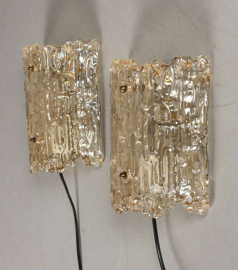 A Pair of Wall Lights by Carl Fagerlund for Orrefors, Sweden.
Circa 1960th. Textured Crystal Glass with brass hardware.
H-21cm
Existing european wiring, re-wiring available upon request.
Item on SALE, no additional discount apply.