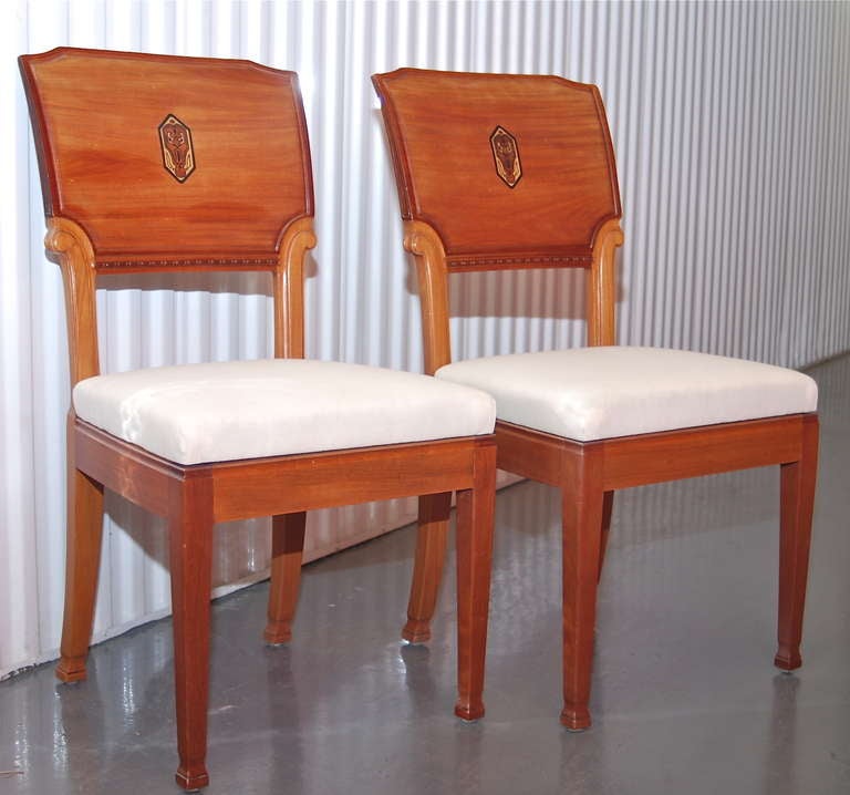 A pair of "Nockeby" chairs by Nordiska Kompaniet, Sweden, circa 1915. Wooden chairs with inlay decoration on the back.
Recently professionally refinished, seats reupholstered in muslin fabric. NK label attached.